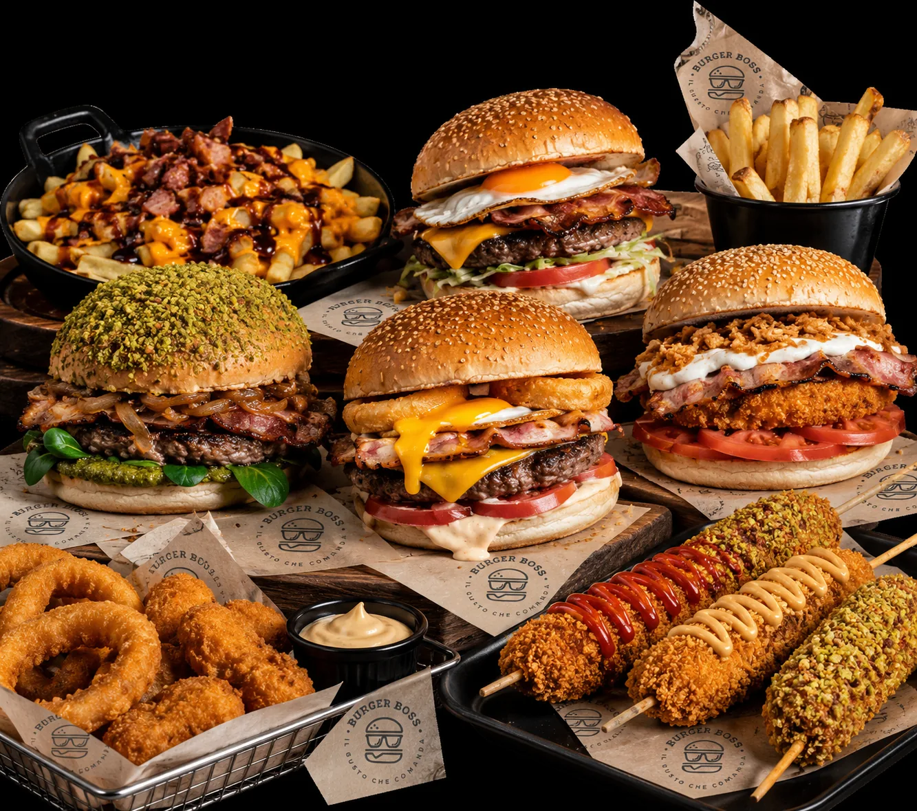 Mesa Burger Boss: hamburguesa al pistacho, cheeseburgers con huevo y bacon, patatas, aros de cebolla, nuggets y churros sobre fondo negro